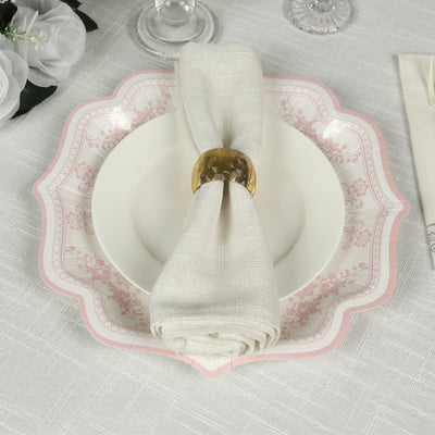 Elegant table setting with a decorative plate and napkin holder.