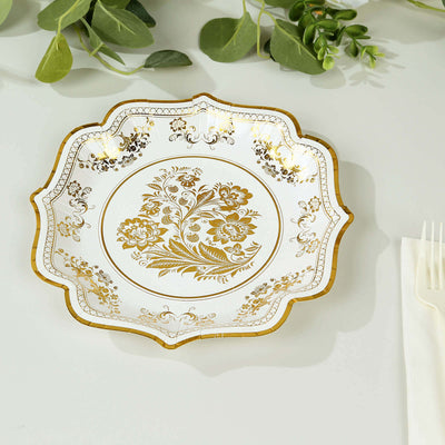 Elegant floral gold-accented plate on a plain background.