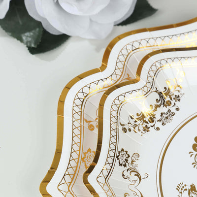 Elegant gold-trimmed decorative plates stacked with floral accents.