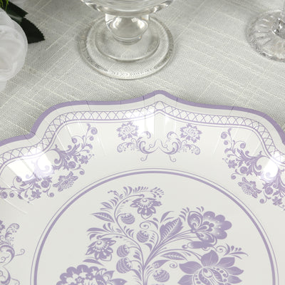 Elegant purple floral decorative serving tray on a textured tablecloth.