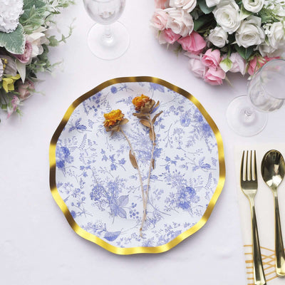 Elegant floral plate with gold rim and dried flowers, set for a refined dining experience.