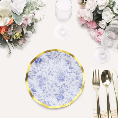 Elegant floral dinner plate with gold accent on a table setting.