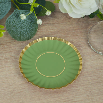 Green decorative plate with gold rim on a wooden surface.