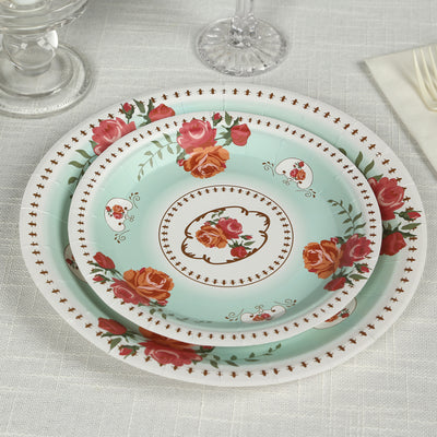 Floral pattern plates in three sizes stacked on a textured surface.
