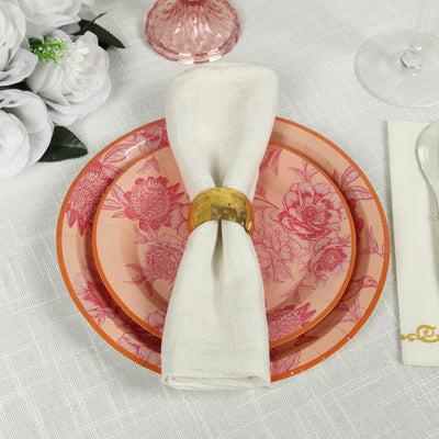 Elegant floral dinnerware set with napkin and napkin ring.