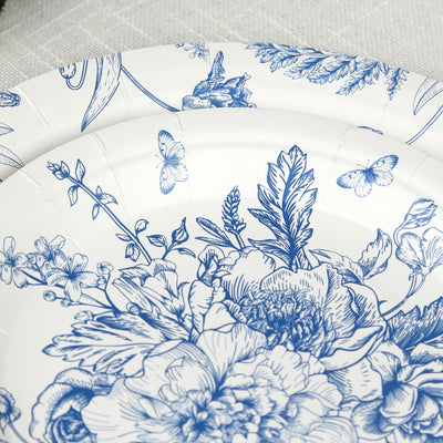Blue floral paper plates on a textured background.