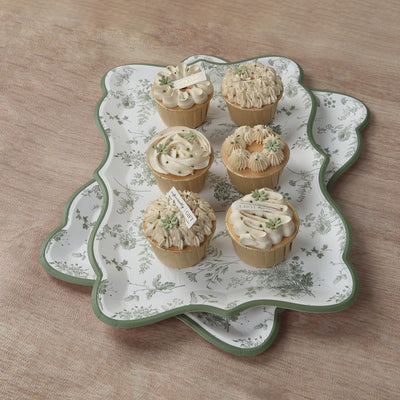 Decorative cupcakes on a floral tray, perfect for celebrations.