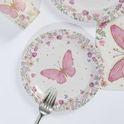 Pink butterfly decorative plate with floral design and fork