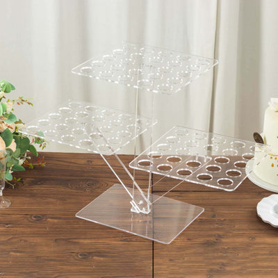 Acrylic cupcake stand with three tiers and circular cutouts for display.