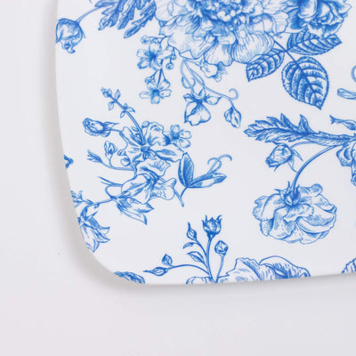 Blue floral porcelain pattern on white ceramic surface