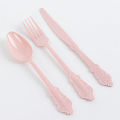 Pink ornate plastic cutlery set of spoon, fork, and knife