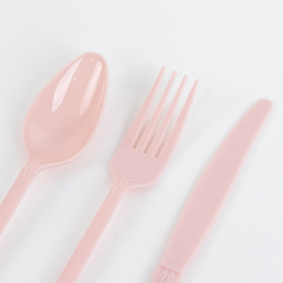 Pink plastic cutlery set including spoon, fork, and knife