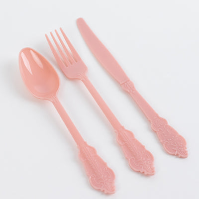 Pink plastic cutlery set including spoon, fork, and knife