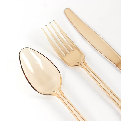 Elegant gold plastic cutlery set: spoon, fork, and knife.