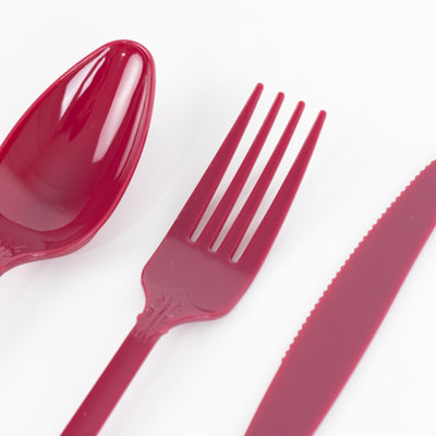 Red plastic cutlery set including spoon, fork, and knife