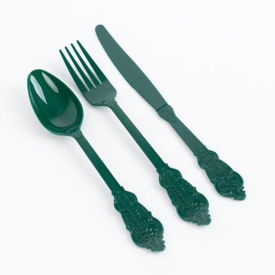 Green plastic cutlery set including a spoon, fork, and knife