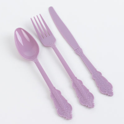 Purple ornate plastic cutlery set including spoon, fork, and knife.