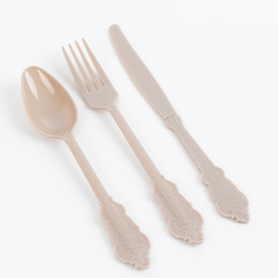Elegant plastic cutlery set: spoon, fork, and knife in soft beige color