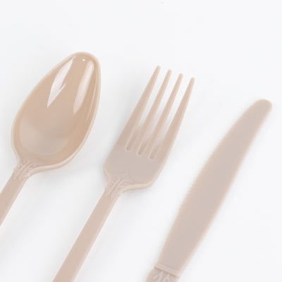 Beige plastic cutlery set including spoon, fork, and knife