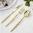 Gold stainless steel cutlery set with knife, fork, and spoon on white linen
