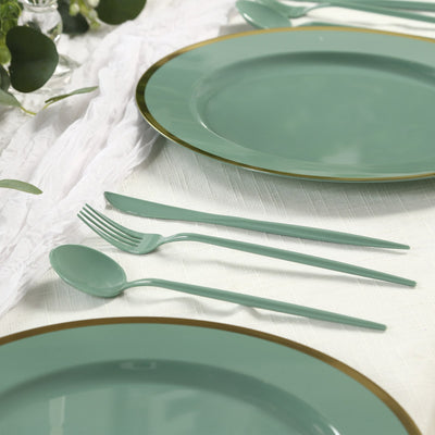 Elegant mint green dinnerware set with gold rim and matching cutlery.