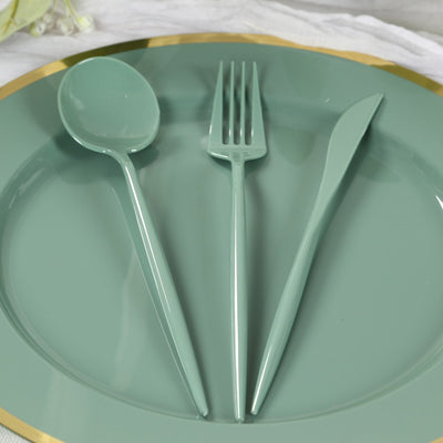 Mint green cutlery set on a decorative plate.