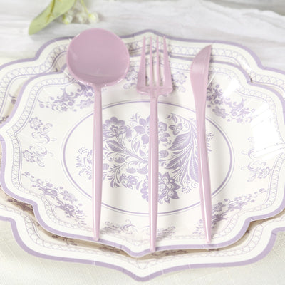 Elegant lavender cutlery set on decorative plates. Perfect for special occasions.