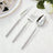 Silver beaded flatware set with knife, fork, and spoon on white cloth