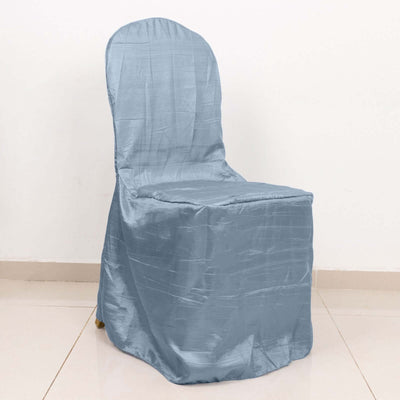 Blue chair cover draped over a chair on a plain background
