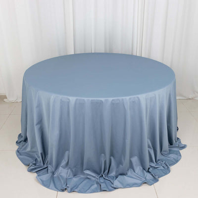 Round blue tablecloth draping elegantly over a circular table.