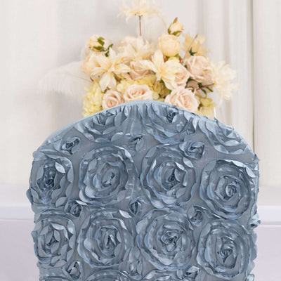 Blue rose-patterned chair cover with floral arrangement in the background.