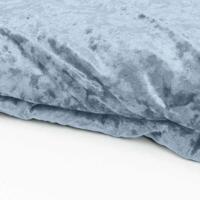 Soft blue velvet fabric close-up texture shot.