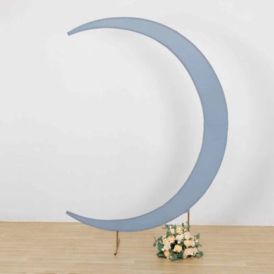 Blue crescent moon backdrop with floral arrangement at the base