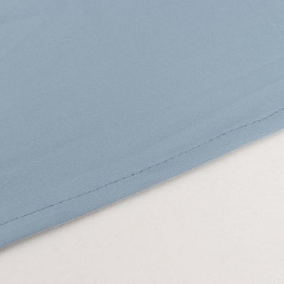 Light blue fabric texture with a clean stitched edge.