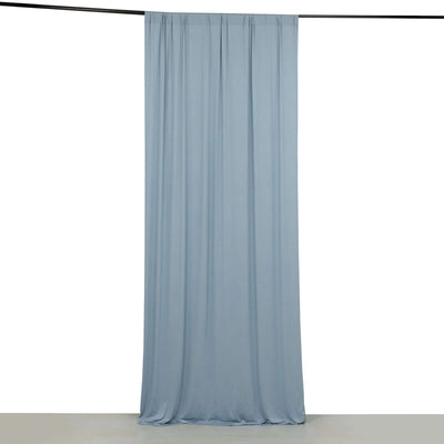 Light blue fabric curtain hanging elegantly against a plain background