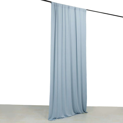 Light blue fabric curtain draped on a rod