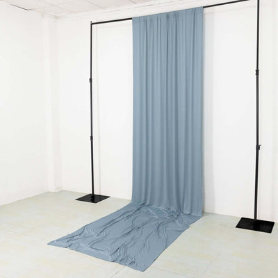 Blue fabric backdrop draped on a black frame in a studio setting.
