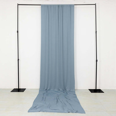 Blue fabric draped on a black frame in a studio setting.