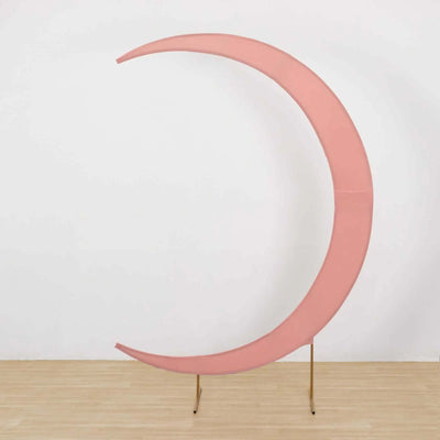 Pink crescent moon sculpture on a gold stand