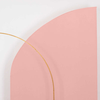 Curved pink backdrop with a gold arc detail