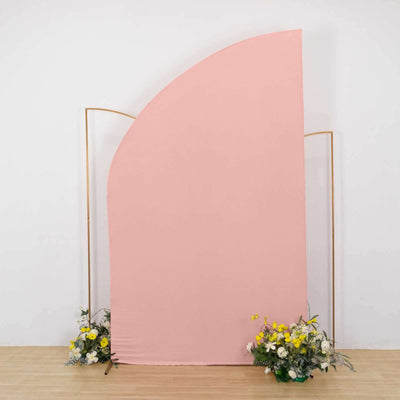 Pink fabric backdrop with floral arrangements at the base.