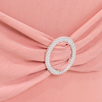 Pink dress detail featuring a sparkling rhinestone belt buckle.