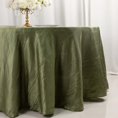 Olive green textured tablecloth draping elegantly over a table.