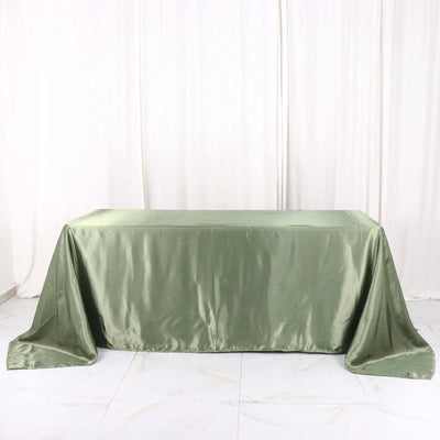 Green satin tablecloth draped elegantly over a table