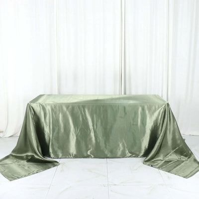 Olive green satin tablecloth draped elegantly over a table.