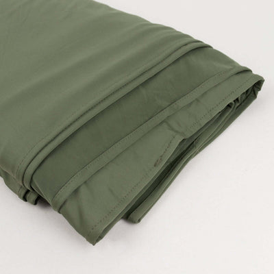 Folded olive green fabric on a plain background.
