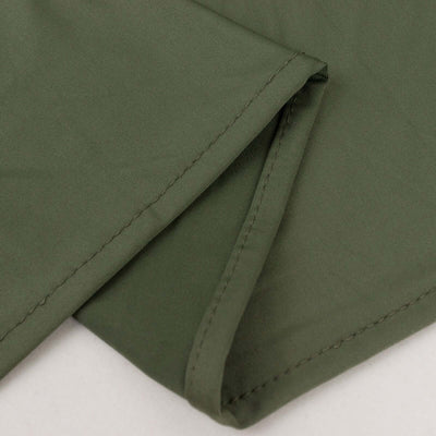 Green fabric close-up showing texture and stitching details.