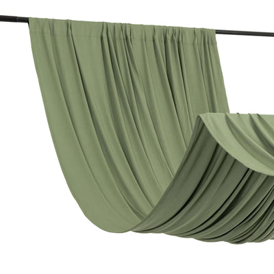 Green draped fabric on a rod, showcasing soft folds and texture.