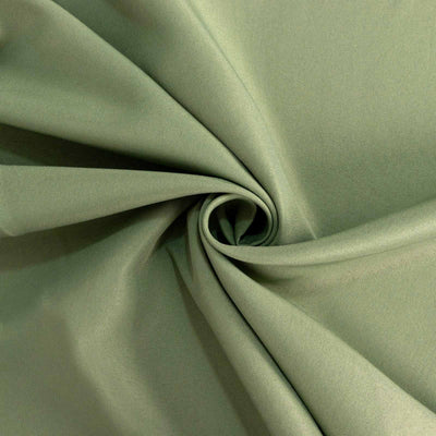 Textured green fabric in a spiral arrangement.