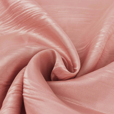 Soft pink satin fabric with a smooth, flowing texture.